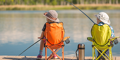 children fishing in wilderness